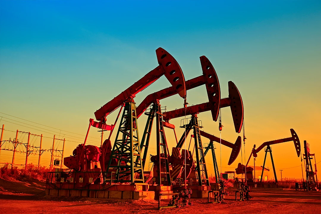oil jacks in a sunset